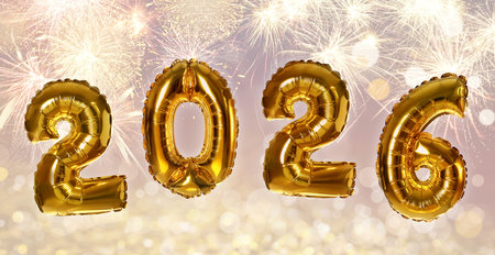 Happy New 2026 Year. Golden balloons in shape of numbers against fireworks, bokeh lights. Greeting...