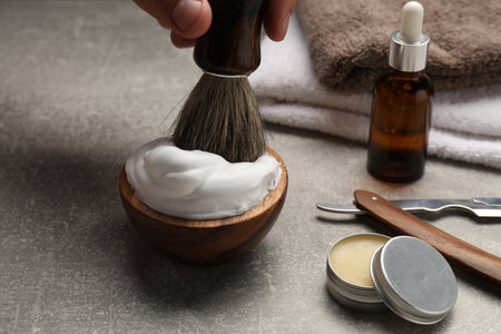 Barber with tools at gray table, closeupの写真素材