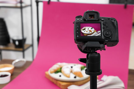 Shooting tasty croissants with camera in studio, selective focus. Professional food photographyの写真素材