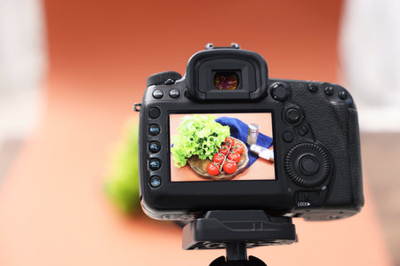 Shooting fresh vegetables and spices with camera in studio, selective focus. Professional food photographyの写真素材