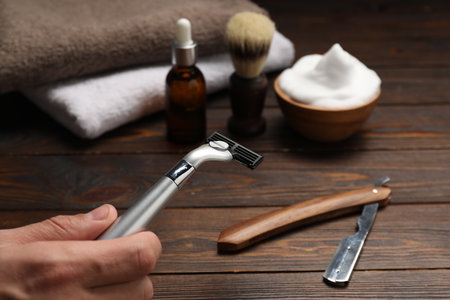 Barber with tools at wooden table, closeupの写真素材