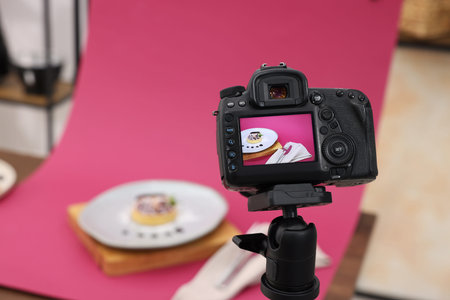 Shooting tasty tartlet with camera in studio, selective focus. Professional food photographyの写真素材