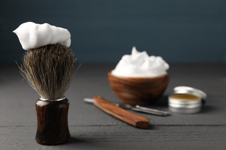 Different barber's tools on gray wooden table, closeupの写真素材