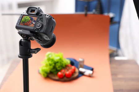 Shooting fresh vegetables and spices with camera in studio, selective focus. Professional food photographyの写真素材
