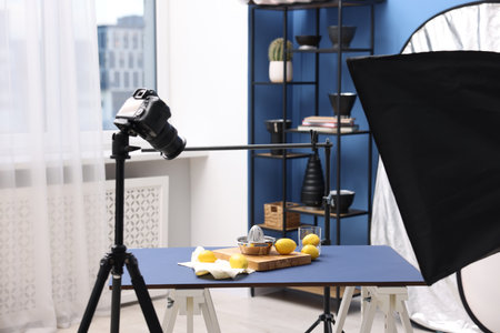 Shooting fresh lemons and juicer with camera in studio. Professional food photographyの写真素材