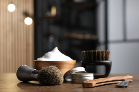 Barber's tools on wooden table in barbershop, closeup. Space for textの写真素材