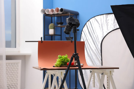 Shooting fresh vegetables and spices with camera in studio. Professional food photography