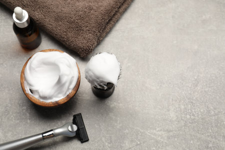 Different barber's tools on gray background, closeup. Space for textの写真素材