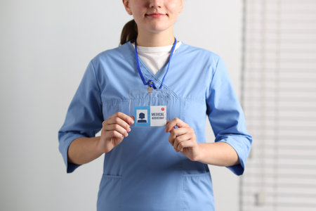 Medical assistant with badge in clinic, closeupの写真素材