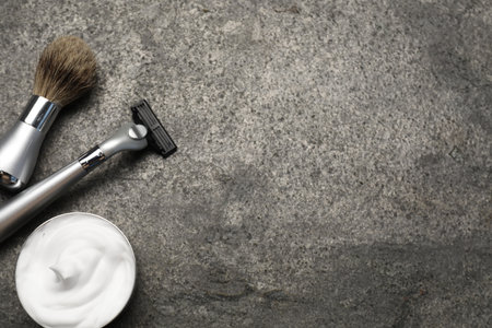 Different barber's tools on gray background, flat lay. Space for textの写真素材