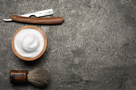 Different barber's tools on gray background, flat lay. Space for textの写真素材