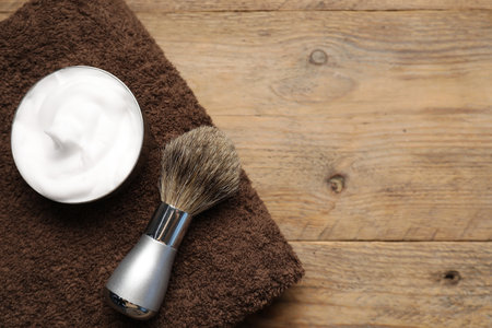 Different barber's tools on wooden background, flat lay. Space for textの写真素材