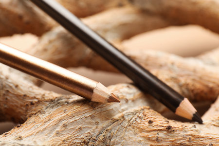 Different color eye pencils on wood, closeupの写真素材