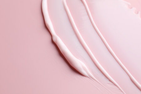 Sample of cosmetic product on pink background, closeup. Space for textの写真素材