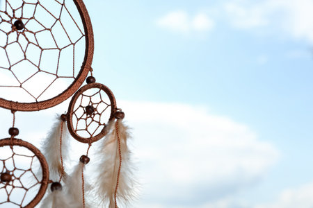 Shamanism. Beautiful dream catcher hanging outdoors, closeup. Space for textの写真素材