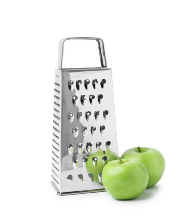 Grater and fresh apples isolated on whiteの写真素材