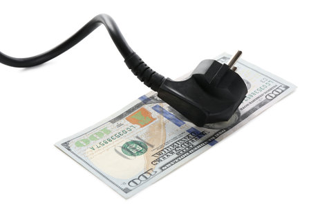 Electrical wire with plug and dollar banknote isolated on whiteの写真素材