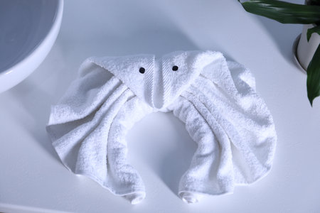 Cute crab made with towel on countertop in bathroom, above viewの写真素材