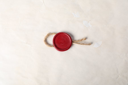Old parchment paper with wax seal as background, top viewの写真素材