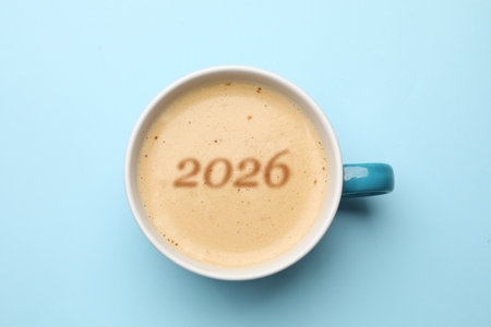 Cup of coffee with numbers on light blue background, top viewの写真素材