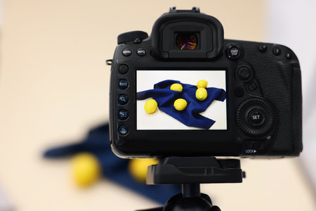 Shooting fresh lemons with camera in studio, selective focus. Professional food photographyの写真素材