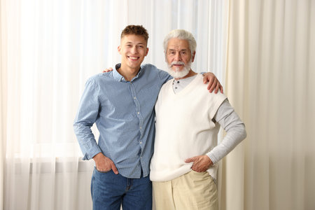 Father and son hugging each other at home