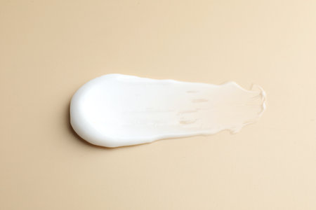 Sample of moisturizing cream on beige background, top viewの写真素材