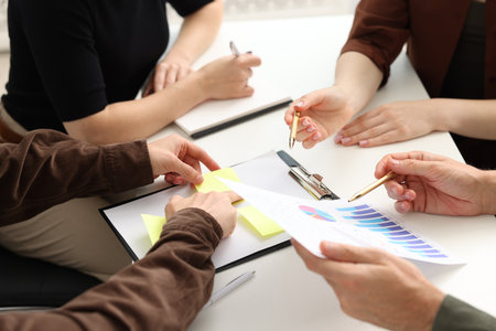 Business process. Colleagues working together at desk in office, closeupの写真素材