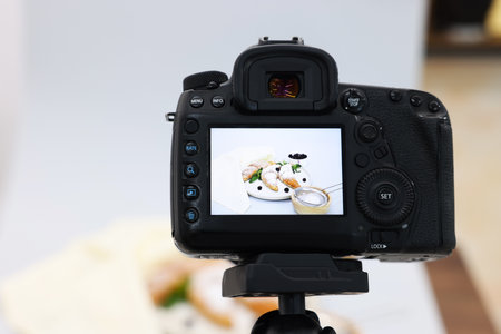 Shooting tasty croissants and ingredients with camera in studio, selective focus. Professional food photographyの写真素材