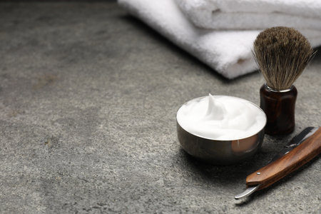 Different barber's tools on gray background, closeup. Space for textの写真素材