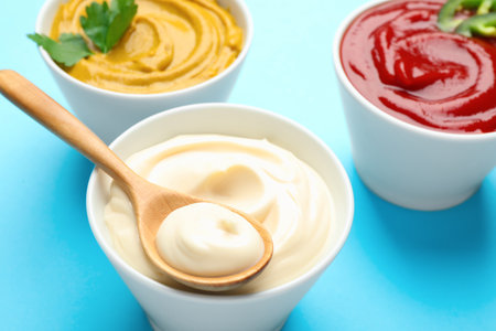 Different sauces on light blue background, closeupの写真素材