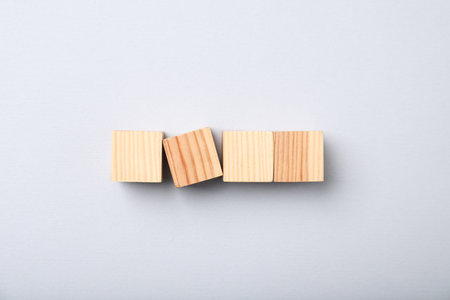 Wooden cubes on light background, top viewの写真素材