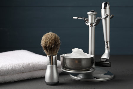 Different barber's tools on gray wooden table, closeupの写真素材