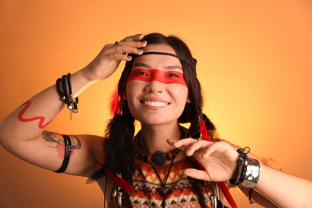 Shaman woman with face painting on orange gradient background