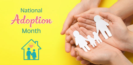 National Adoption Month poster with illustration of house. Parents with child holding paper cutout of family on yellow background, top view. Banner designの写真素材