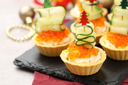 Tasty tartlets on gray textured table, closeup.の写真素材