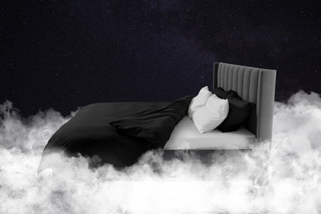 Large bed in starry night skyの写真素材