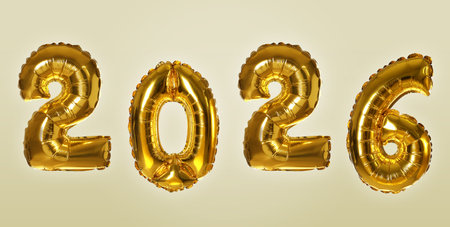 Golden balloons in shape of numbers on beige gradient background