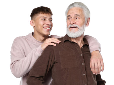 Son hugging his father on white backgroundの写真素材