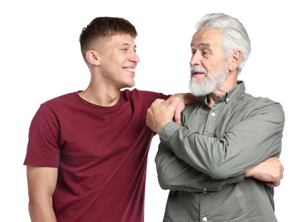 Portrait of father and son on white backgroundの写真素材
