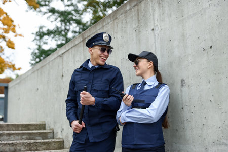 Police officers in uniforms on city streetの写真素材