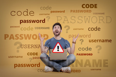 Shocked man with laptop trying to remember password and username. Orange background with wordsの写真素材