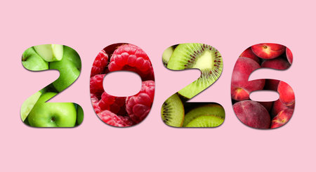 2026 numbers with fruits inside on pink background. New Year bannerの写真素材