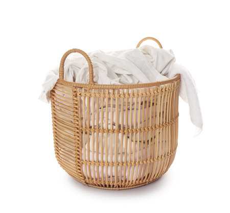 Laundry basket with clothes isolated on whiteの写真素材