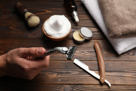 Barber with tools at wooden table, closeupの写真素材