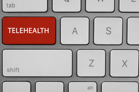 Red button with word Telehealth on computer keyboard, closeupの写真素材