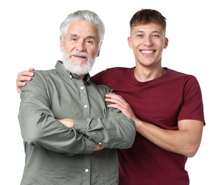 Son hugging his father on white backgroundの写真素材