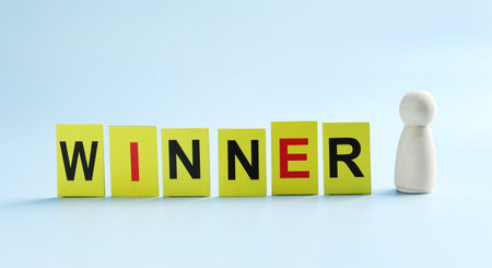 Cards with word Winner and human figure on light blue backgroundの写真素材