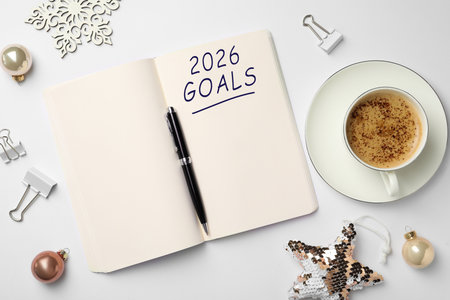 New 2026 Year Goals. Inscription in notebook on table with festive stuff and coffee, top viewの写真素材