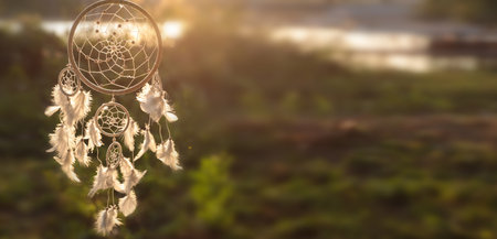 Dream catcher with feathers in nature. Banner designの写真素材